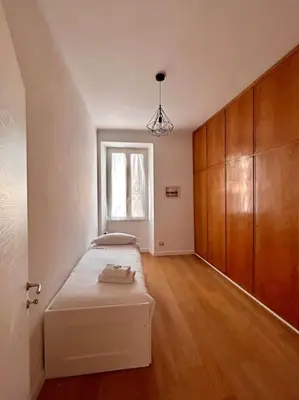 a bedroom with a bed and a window in it at Angel House - balcony and view in Rome