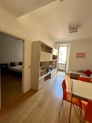 a living room with a bed and a couch in a room at Angel House - balcony and view in Rome