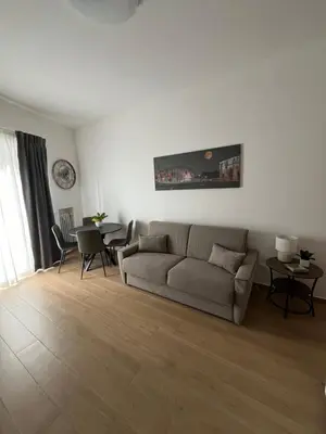 a living room with a couch and a table at Casa di Alice in Rome