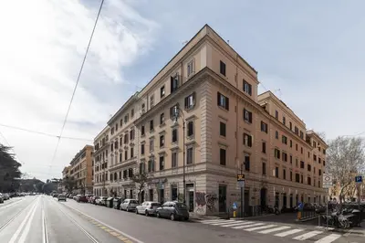 a large building on the side of a city street at Amazing & Romantic *Loft Testaccio Aventino* in Rome