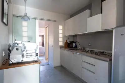 a kitchen with a mixer on top of a counter at Panoramic Apartment Trastevere in Rome