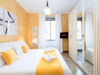 a bedroom with a white bed with towels on it at {Colosseum 10 minutes} Netflix & Free Wi-Fi in Rome