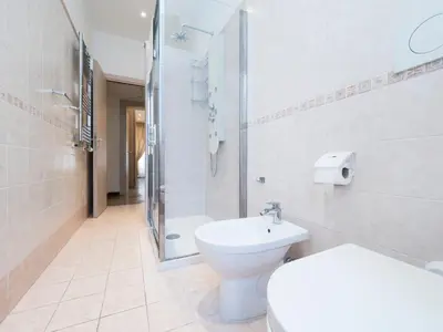 a bathroom with a toilet and a shower and a sink at {Colosseum 10 minutes} Netflix & Free Wi-Fi in Rome