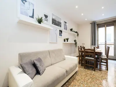 a living room with a couch and a dining room at {Colosseum 10 minutes} Netflix & Free Wi-Fi in Rome