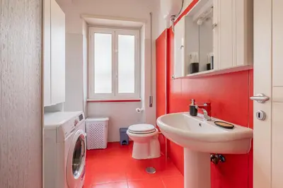 a bathroom with a white sink and a toilet at Basilica San Giovanni 1Bedr 5 minut from Station in Rome