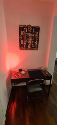 a room with a wooden desk with a sign on the wall at Aroma Vaticano - Appartamento a San Pietro in Rome