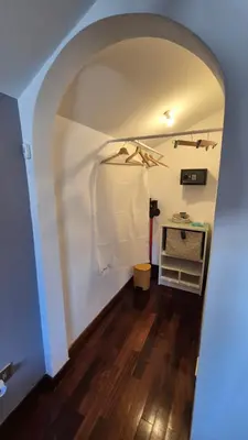 a hallway with an archway in a house at Aroma Vaticano - Appartamento a San Pietro in Rome