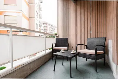 two chairs and a table on a balcony at Ascanio's Cozy Apartment - by 101Flats in Rome