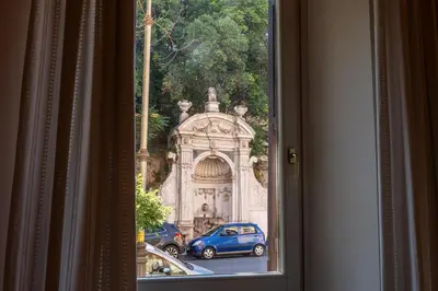 a view of a building through a window at Trastevere Design & Comfort in Rome