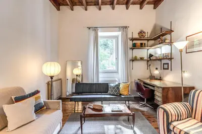 a living room with a couch and a table at Trastevere Design & Comfort in Rome