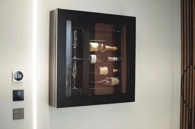 a picture of a wine rack on a wall at Tritone Luxury Suites Fontana di Trevi in Rome
