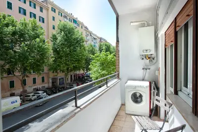 a balcony with a washing machine on a building at Appartamento Romantico a Trastevere in Rome