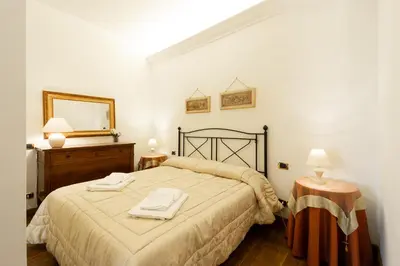 a bedroom with a bed with two towels on it at Altobelli Apartment in Rome