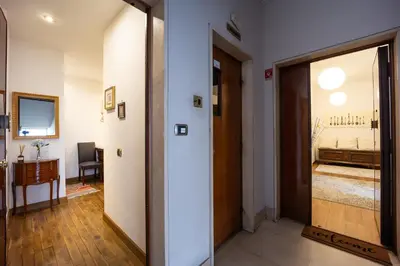 a hallway with a door leading to a bedroom at Altobelli Apartment in Rome