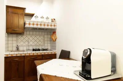 a kitchen with a microwave sitting on a table at Altobelli Apartment in Rome