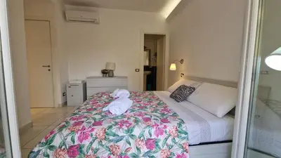 a bedroom with a bed with towels on it at LG colosseum Rome apartment in Rome