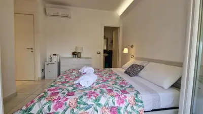 a bedroom with a large bed with towels on it at LG colosseum Rome apartment in Rome