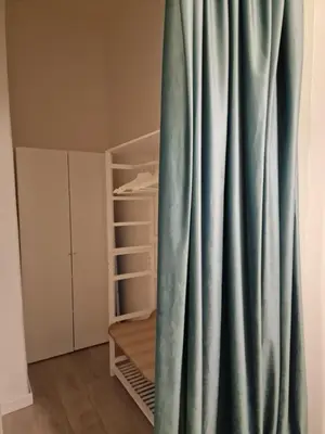 a green curtain in a room with a bunk bed at Casina Valtellina in Rome