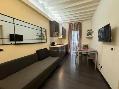 a living room with a couch and a table at Minerva Apartment in Rome