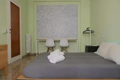 a bedroom with a bed with two towels on it at Rome Sleep Home Bed & Breakfast in Rome