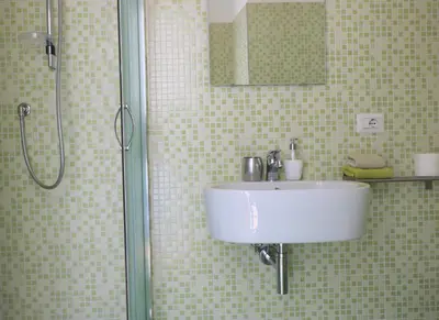 a bathroom with a sink and a shower at Rome Sleep Home Bed & Breakfast in Rome