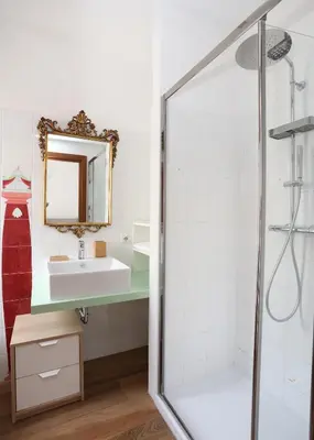 a bathroom with a sink and a shower at Bibi’s house Vaticano in Rome