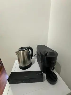 a coffee maker and a tea kettle on a counter at Room Sapienza in Rome