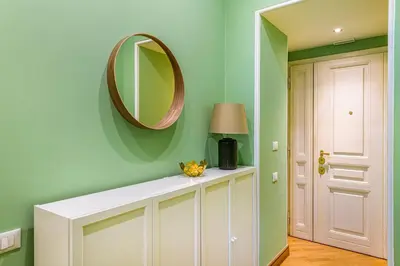 a room with a white cabinet and a mirror at Lion Aparts Rome in Rome