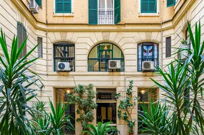 a building with windows and plants in front of it at Lion Aparts Rome in Rome