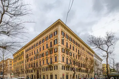 a large brick building on a city street at Lion Aparts Rome in Rome