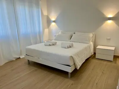 a bathroom with a sink and a toilet and a mirror at Trastevere Tre Porte Apartments in Rome