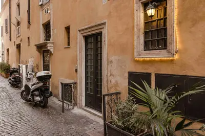 a scooter parked on a street next to a building at Piazza Navona Luxury Loft in Rome