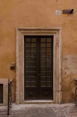 a black door in the side of a building at Piazza Navona Luxury Loft in Rome