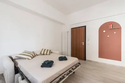 a bedroom with a bed with two towels on it at La Casina 348 in Rome