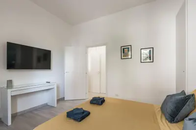 a living room with a flat screen tv and a couch at La Casina 348 in Rome
