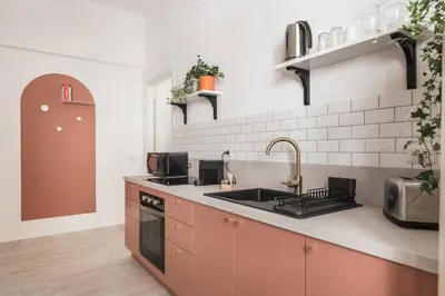 a kitchen with a sink and a stove at La Casina 348 in Rome