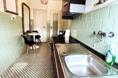 a kitchen with a sink and a counter top at 129 Gallery’s Studio @ Vatican in Rome