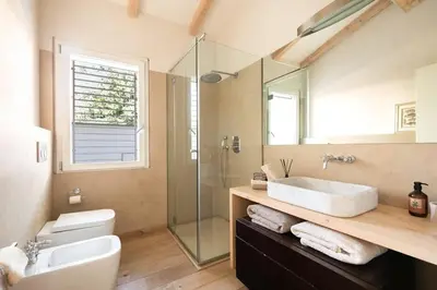 a bathroom with a sink and a glass shower at Rome Design Villa in Rome