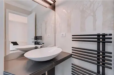 a bathroom with a white sink and a mirror at Beautiful Vatican in Rome
