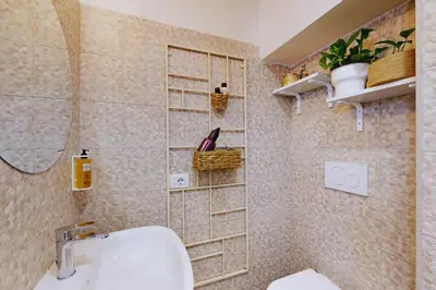 a bathroom with a sink and a toilet in a room at Casa Vacanze BorgoVI House in Rome