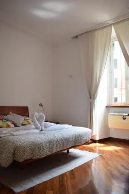a bedroom with a bed with a swan on it at Casa Vacanze Mazzini in Rome