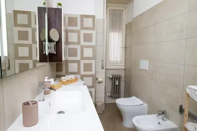 a bathroom with a sink and a toilet at Aureliana House Roma in Rome