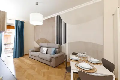 a living room with a table and a couch at Aureliana House Roma in Rome