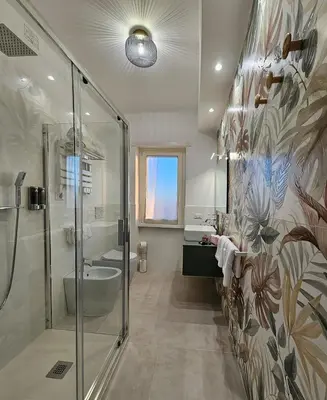 a bathroom with a shower and a sink at B&B Domus Teano Luxury Rooms in Rome