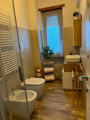 a bathroom with a toilet and a sink at La Casa di Marilù Vicino a Trastevere in Rome