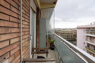 a balcony with two chairs and a window at La Casa di Marilù Vicino a Trastevere in Rome