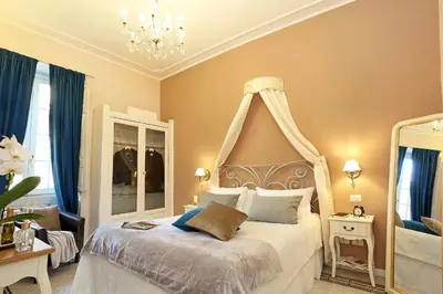 a bedroom with a bed with a canopy at Liberty Rome Suites - Liberty Collection in Rome