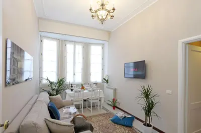 a living room with a couch and a table at Liberty Rome Suites - Liberty Collection in Rome