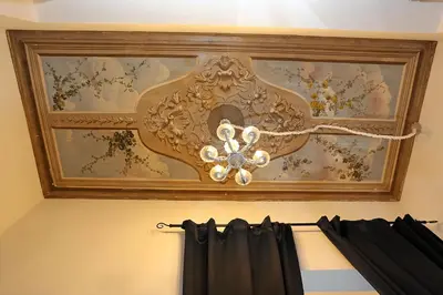 a painting of a ceiling with a chandelier at Liberty Rome Suites - Liberty Collection in Rome
