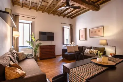 a living room with a couch and a table at Trastevering in Rome in Rome